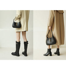 Black Classic Curved Leather Handbag with Signature Buckle Closure