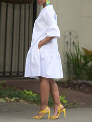 Loose Three-Quarter Sleeves Asymmetric Buttoned Pleated Pockets Solid Color Split-Joint Round-Neck Midi Dresses