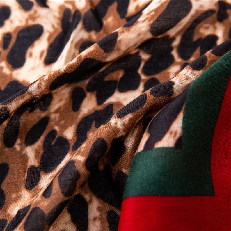 Leopard Print Scarf With  A Red And Green Trim