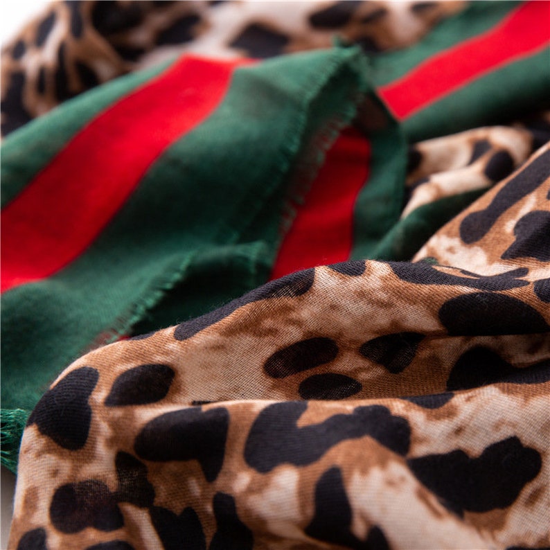Leopard Print Scarf With  A Red And Green Trim