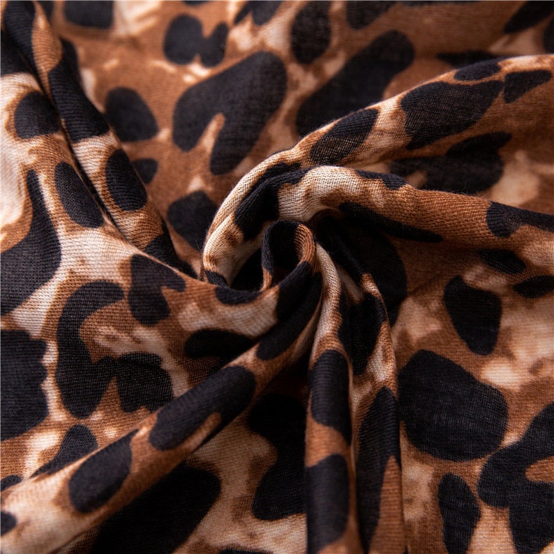 Leopard Print Scarf With  A Red And Green Trim